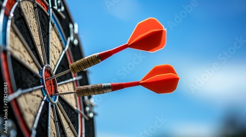 Close-up of darts striking bullseye with precision