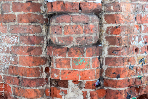 fragment of a brick wall of an old house