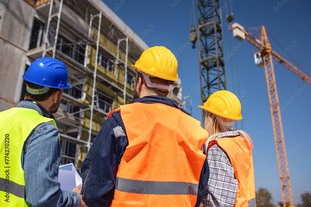 Construction team planning a building blueprint project on site with collaboration for architect innovation. Architecture, design and engineers with teamwork for successful Construction team planning a building blueprint project on site with collaboration for architect innovation. Architecture, design and engineers with teamwork for successful