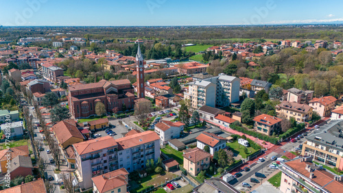 Limbiate aerial view, the parish of St. George, the church, homes and streets downtown. Monza and Brianza. 02-04-2024. Italy
