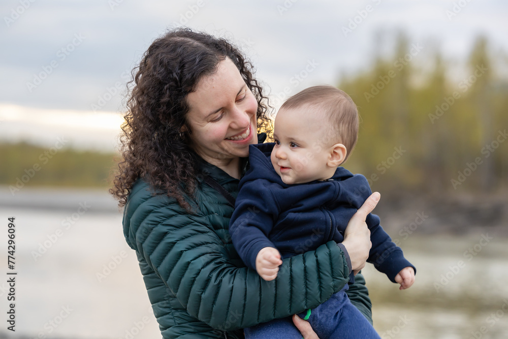 Mother and Baby Boy outside in nature by the river. Mother and Baby Boy outside in nature by the river.