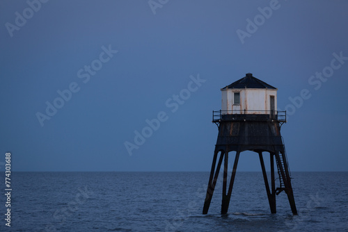 Lighthouse in the sea, Dovercourt low lighthouse at high tide built in 1863 and discontinued in 1917 and restored in 1980 the 8 meter lighthouse is still a iconic sight after sunset