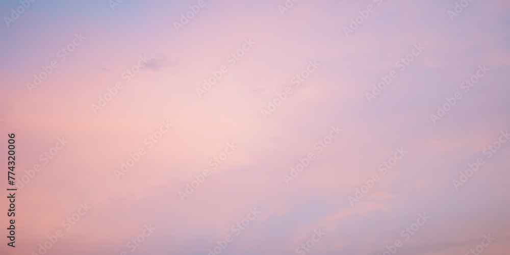 Majestic dusk. Sunset sky twilight in the evening with colorful sunlight. Pastel colors. Abstract nature background. Calm gentle pink, purple and yellow clouds