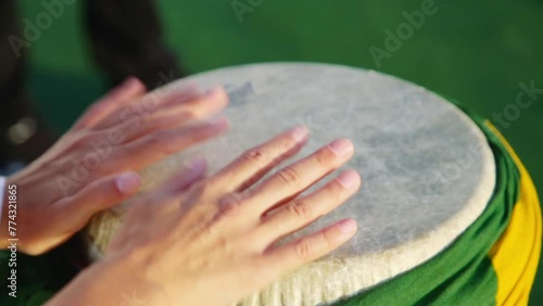 Rio Brazil Samba Cranival Music Played On Drum Wrapped With Brazil Flag Hands Only photo