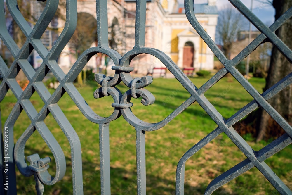 Openwork metal fence. Selective focus. Openwork metal fence. Selective focus.