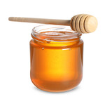 Tasty natural honey in glass jar and dipper isolated on white
