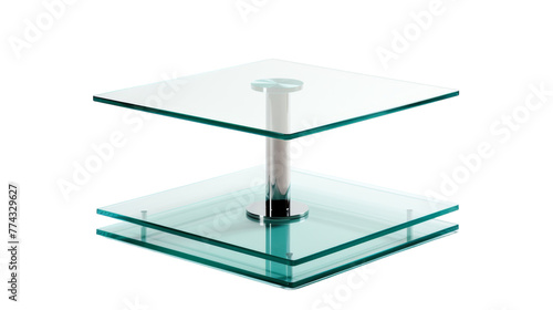 A modern square glass table with a sleek metal base reflecting light