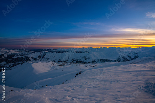 Sunset over snowy mountains