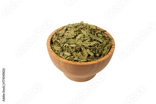 Dried leaves o Lemon verbena in latin Aloysia citrodora in wooden bowl isolated on white background. Medicinal herb. 