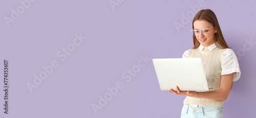 Female student with laptop ...