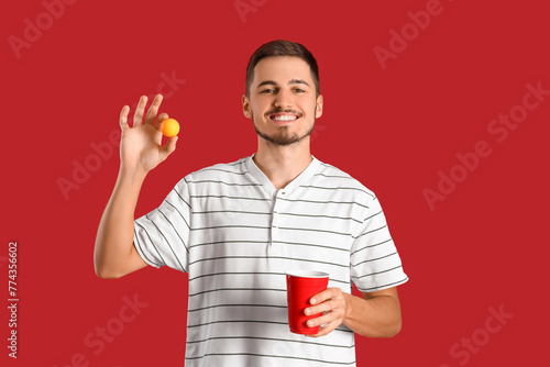 Young man with cup and ball...