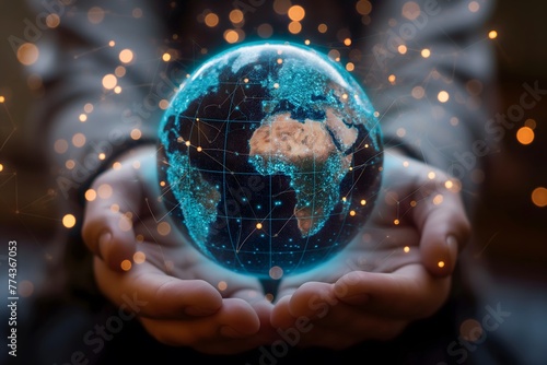 Hände halten einen digitalen Globus mit darüberliegenden digitalen Verbindungen und Knoten, der ein Netzwerk und globale Kommunikation darstellt, Konzept Vernetzung photo