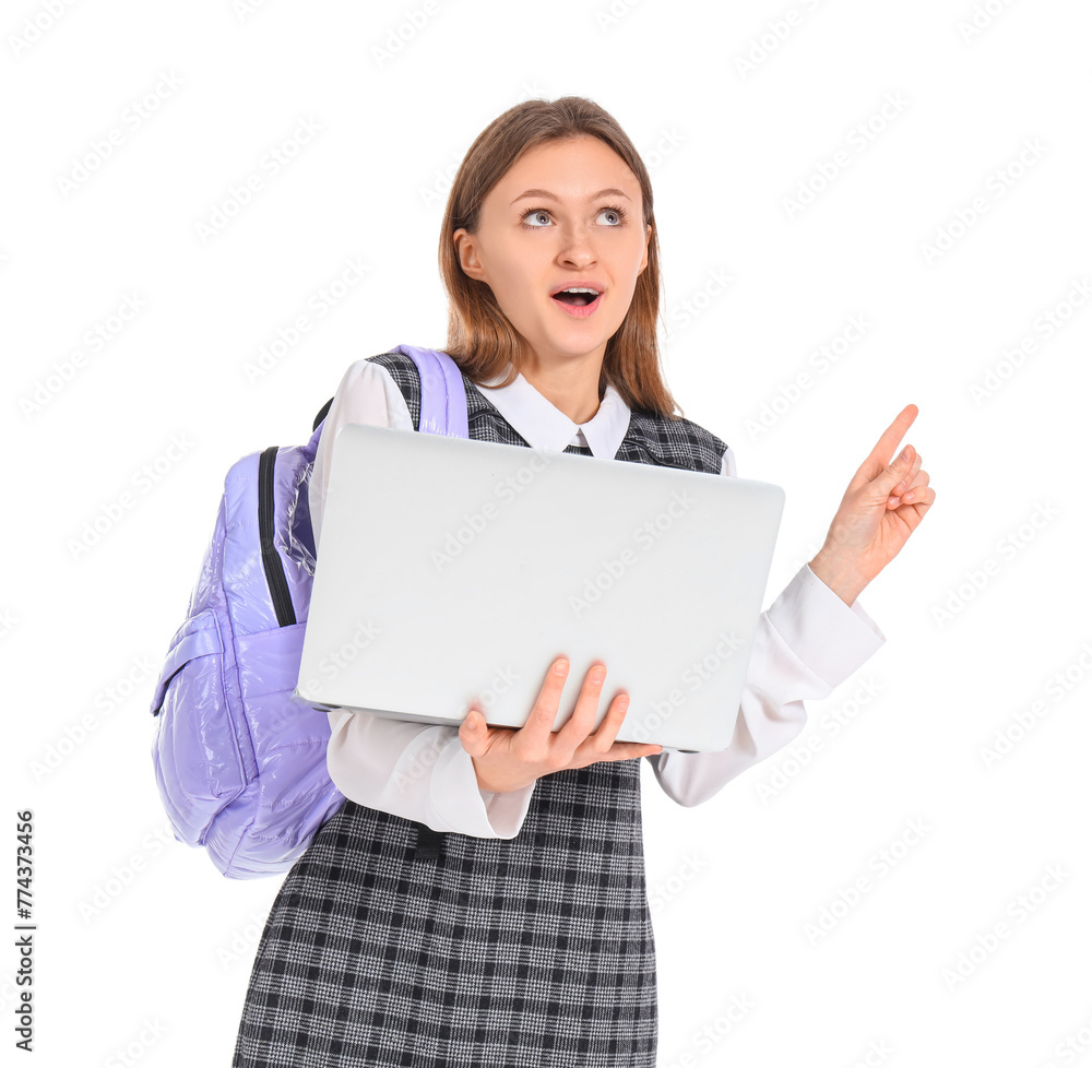 Female student with laptop pointing up on white background. End of school concept Female student with laptop pointing up on white background. End of school concept