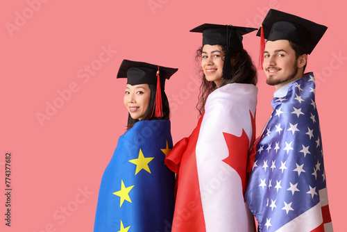 Proud graduate students wit...