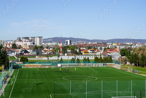 Photography Beautiful Bratislava cityscape in early spring sunny morning with the soccer fie