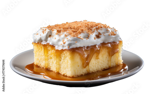 A luscious piece of cake sitting on a plate, drenched in rich caramel sauce