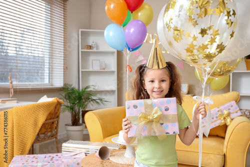 Cute little girl in party h...