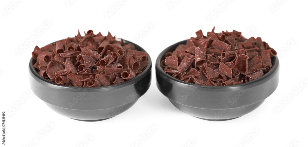 Delicious chocolate shavings in bowls isolated on white Delicious chocolate shavings in bowls isolated on white