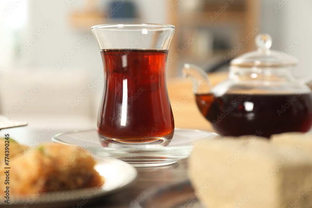 Cup of delicious Turkish tea served on wooden table, closeup Cup of delicious Turkish tea served on wooden table, closeup