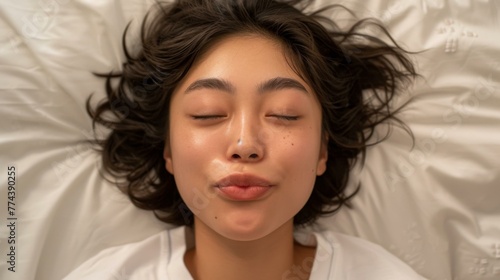 A woman laying in bed with her eyes closed. Generative AI.