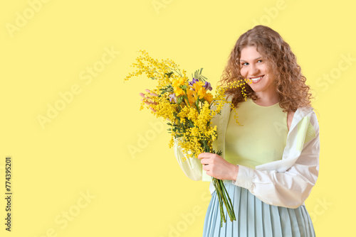 Happy young woman with bouq...