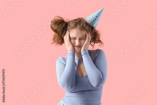 Young woman with hangover a...