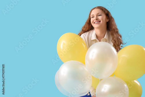 Young woman with balloons o...