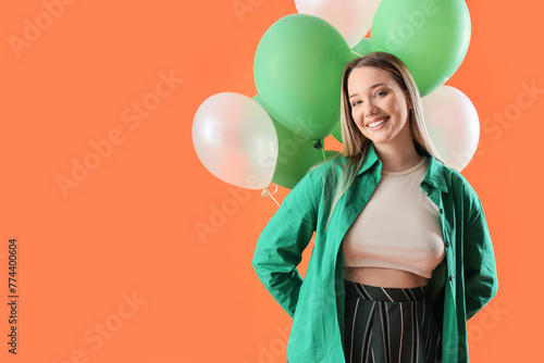 Young woman with balloons o...