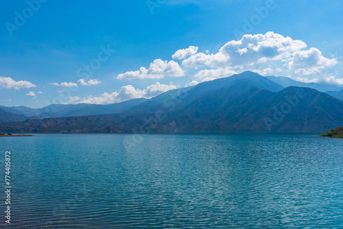 Lake Potrerillos in Mendoza, Argentina. Blue lake in the mountains with a beautiful sky