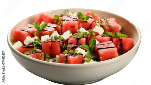 A white bowl overflows with sweet watermelon chunks and tangy feta cheese cubes