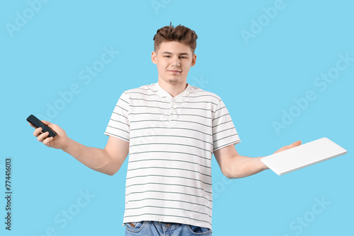 Young man with mobile phone...
