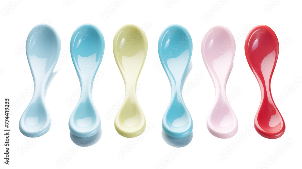 A harmonious arrangement of spoons lined up side by side A harmonious arrangement of spoons lined up side by side