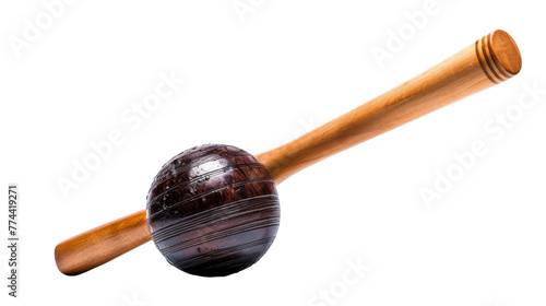 A wooden bat poised next to a baseball on a white background