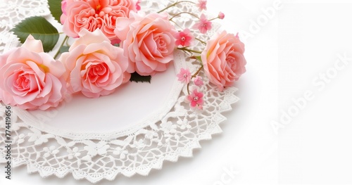 bouquet of pink roses and white lace doily on the table. 