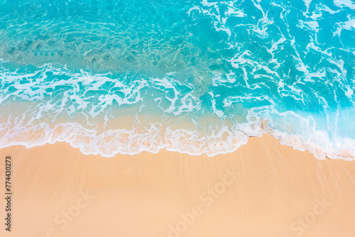 Aerial top view on nature landscape view of beautiful tropical clean sandy beach and soft blue ocean. Aerial top-down view.