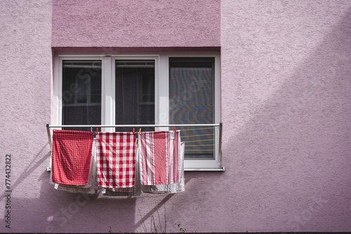 Kitchen towels drying in the sun, Clothes Hanging to Dry on a Clothesline, Washing line with clean laundry and clothespins outdoors
