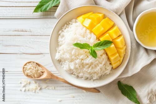 Thai Mango Sticky Rice on white wood background