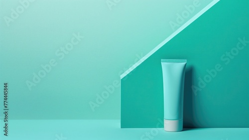 White tube on a two-tone teal background with minimalist aesthetic and geometric shape