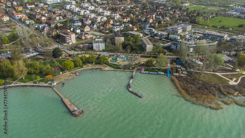 Balatonfüred, nestled on the shores of Lake Balaton in Hungary, is a charming resort town renowned for its picturesque landscapes, therapeutic thermal waters, and vibrant scene captured from drone photo