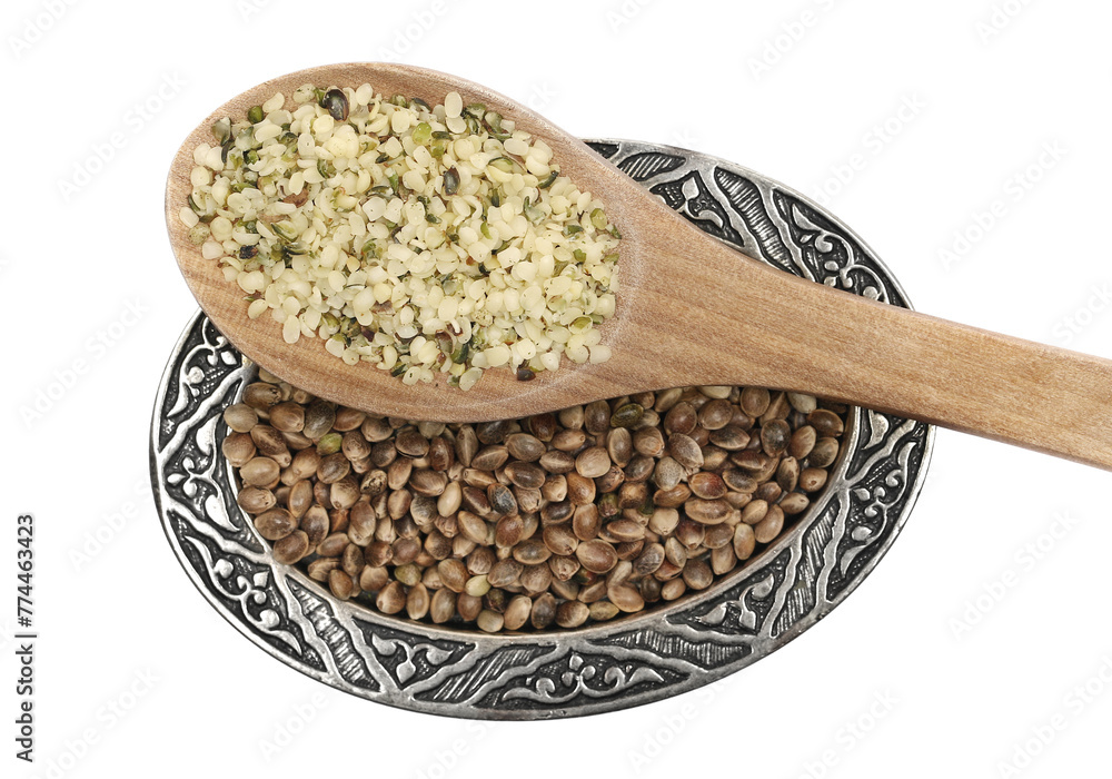 Peeled hemp seed and grain in wooden spoon isolated on white background, top view Peeled hemp seed and grain in wooden spoon isolated on white background, top view