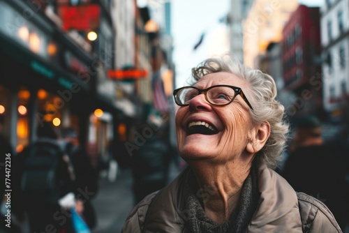 Portrait of happy senior woman with eyeglasses in the city