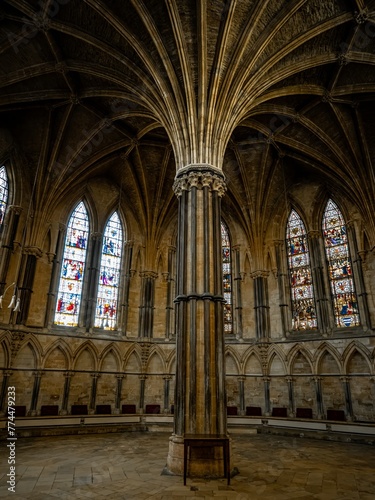 Lincoln Cathedral  Roman Catholic Gothic church and cathedral with stain glass window corridor and hall  with arches  columns  pews  vault  aisles  gallery  arcades and clerestory.