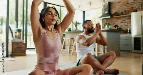 Couple, people and meditation on yoga mat for exercise, fitness and wellness in house, home and living room. Man, woman and gym partners together in lotus position for workout, training or relaxation photo
