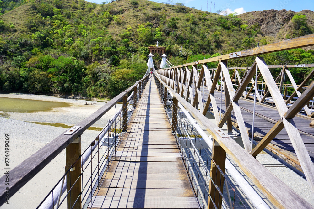 Fototapeta premium Santa Fé de Antioquia, Antioquia, Colombia; January 4, 2024: Western bridge (Puente de Occidente).