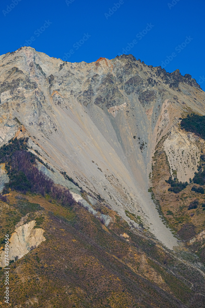 Rocky mountain with different minerals and a triangular shape in Argentine Patagonia.