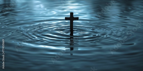 The cross's silhouette casts ripples in water, bridging faith's influence between digital and natural realms on a tranquil blue canvas. photo