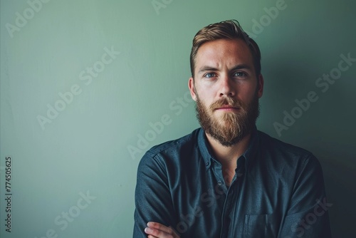 Portrait of a handsome young man with a long beard and mustache © Iigo