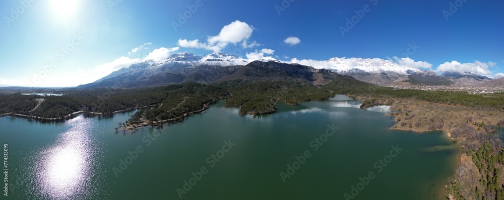 Aerial texture of irrigation dam, forests, trees, ecosystem, mountains and ecological mystical landscape