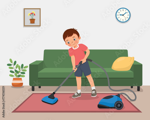 Cute little boy cleaning carpet with vacuum cleaner at the living room
