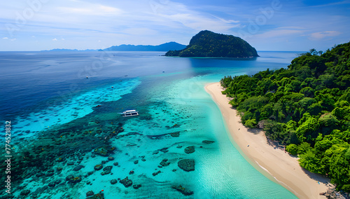 Aerial view showcases a sandy beach near the sea, waves gently lapping the shore